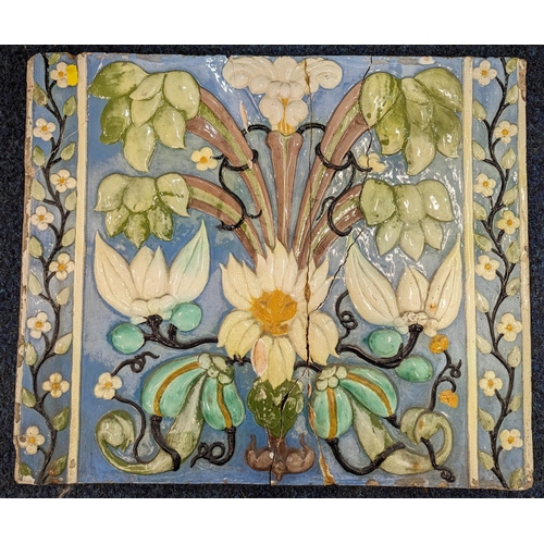 307 - Large Italian relief pottery tile decorated with flowers, 45cmx 54cm.