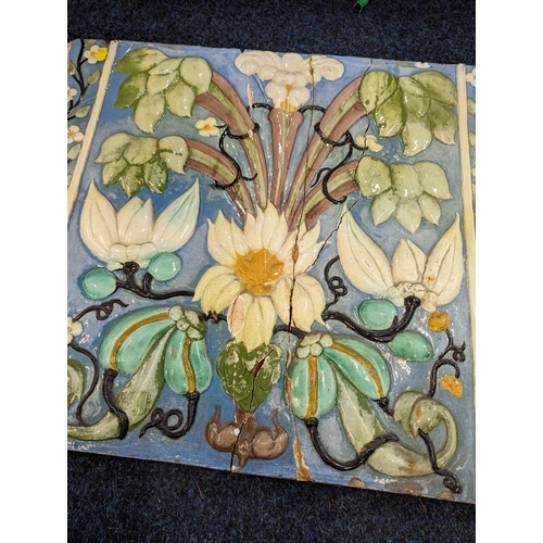 307 - Large Italian relief pottery tile decorated with flowers, 45cmx 54cm.