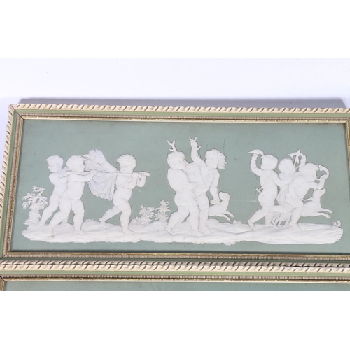 308 - Pair of Wedgwood green jasper ware panels depicting cherubs hunting and cherub musicians, each panel... 