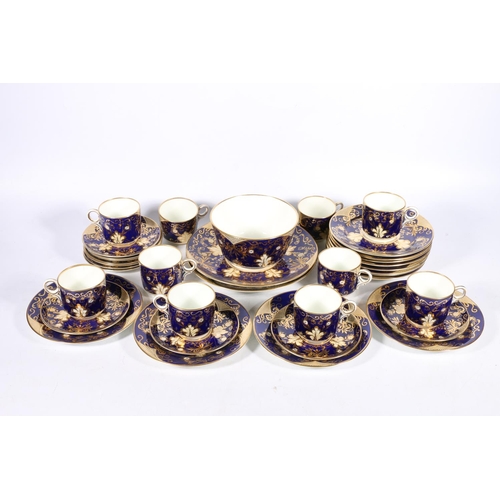 312 - 19th century English porcelain thirty-six piece tea set, the cobalt blue ground decorated with gilt ... 