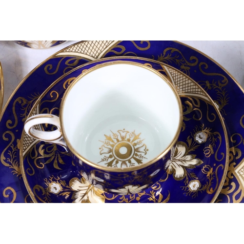 312 - 19th century English porcelain thirty-six piece tea set, the cobalt blue ground decorated with gilt ... 