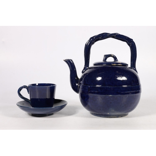 319 - Scottish Pottery, a Dunmore pottery blue glazed tetsubin style teapot and matching cup and saucer. (... 