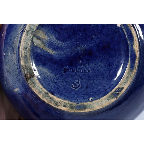 319 - Scottish Pottery, a Dunmore pottery blue glazed tetsubin style teapot and matching cup and saucer. (... 