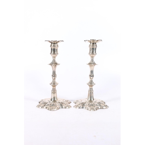 38 - Pair of Georgian silver candlesticks in the manner of William Cafe, makers mark [I pellet S] possibl... 