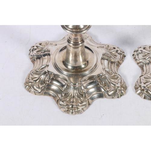 38 - Pair of Georgian silver candlesticks in the manner of William Cafe, makers mark [I pellet S] possibl... 