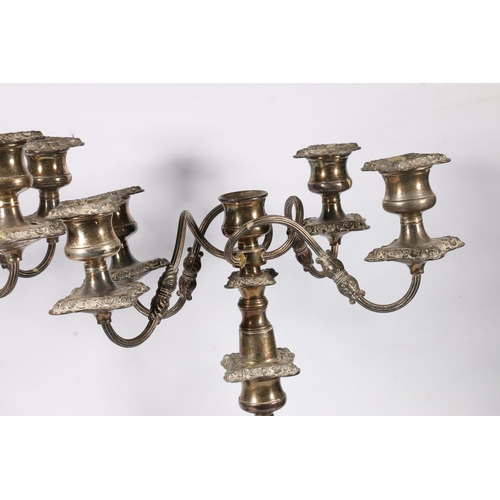 71 - Pair of silver plated four branch, five light candelabra with scroll arms and relief foliate decorat... 