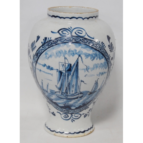 248 - 18th century Delft vase decorated with boats at sea, foliage and scrolls, 22cm high, and two 18th ce... 