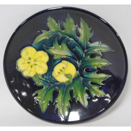 250 - Moorcroft pin dish decorated with tube-lined yellow flowers with green stems on a blue ground, 12cm ... 