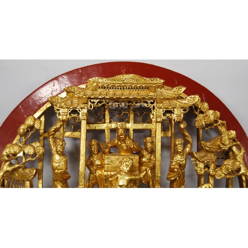 171 - Chinese giltwood wall shrine depicting figures in a palace scene above figures on horseback in a pag... 