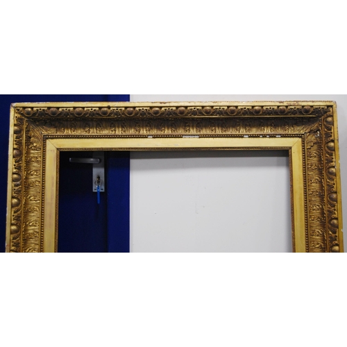 211 - 19th century giltwood and gesso picture frame decorated with acanthus and roundels, aperture 91.5cm ... 