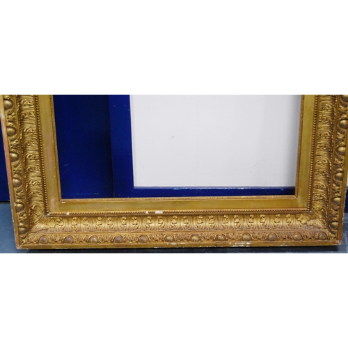 211 - 19th century giltwood and gesso picture frame decorated with acanthus and roundels, aperture 91.5cm ... 