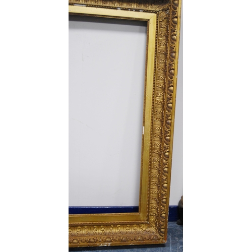 211 - 19th century giltwood and gesso picture frame decorated with acanthus and roundels, aperture 91.5cm ... 