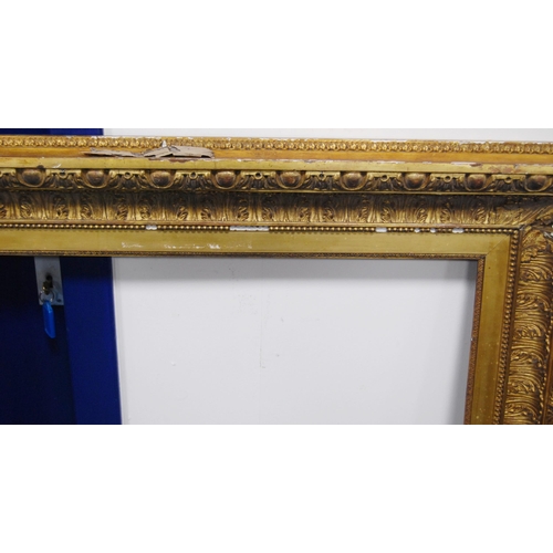 211 - 19th century giltwood and gesso picture frame decorated with acanthus and roundels, aperture 91.5cm ... 