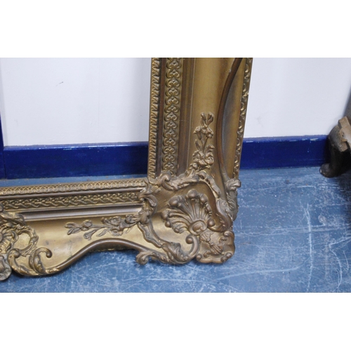 212 - 19th century giltwood and gesso French-style picture frame decorated with scroll cartouche, aperture... 