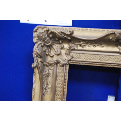 212 - 19th century giltwood and gesso French-style picture frame decorated with scroll cartouche, aperture... 