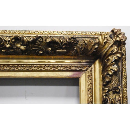 213 - 19th century ornate giltwood and gesso picture frame decorated all over with acanthus scrolls, apert... 