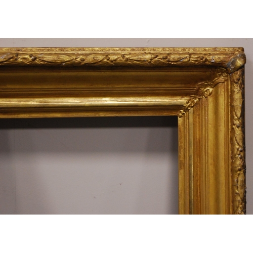 214 - 19th century giltwood and gesso picture frame, aperture 96cm x 74.5cm, overall 116cm x 96cm, and a s... 