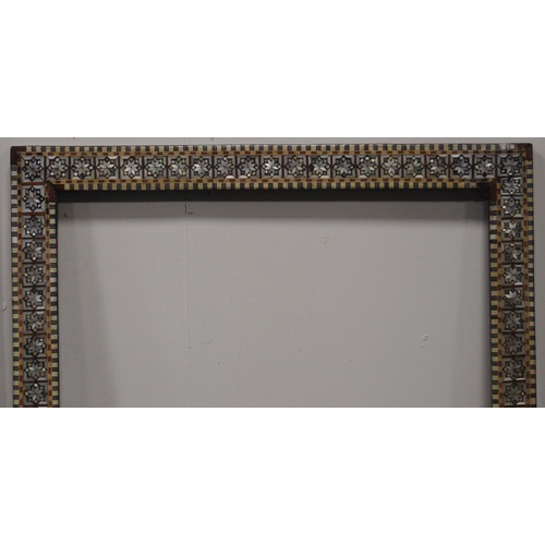 215 - Two near-matching antique Indo-Persian picture frames profusely inlaid with mother of pearl and bone... 