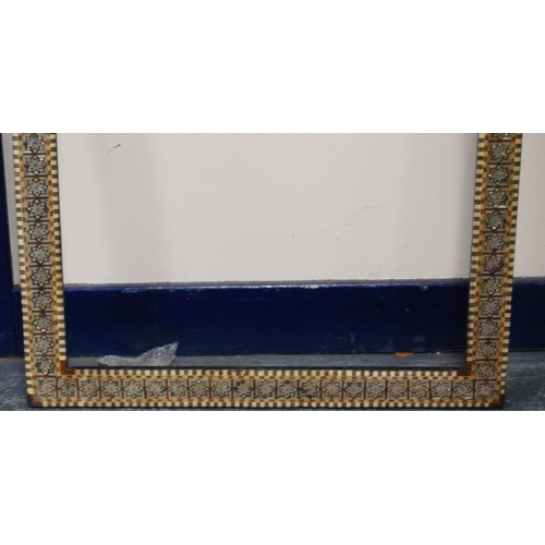 215 - Two near-matching antique Indo-Persian picture frames profusely inlaid with mother of pearl and bone... 