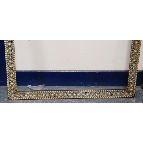 215 - Two near-matching antique Indo-Persian picture frames profusely inlaid with mother of pearl and bone... 