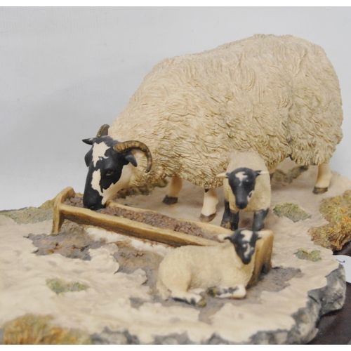 267 - Border Fine Arts group by Ray Ayres, 1988, modelled as two sheep and two lambs at a feeding trough, ... 