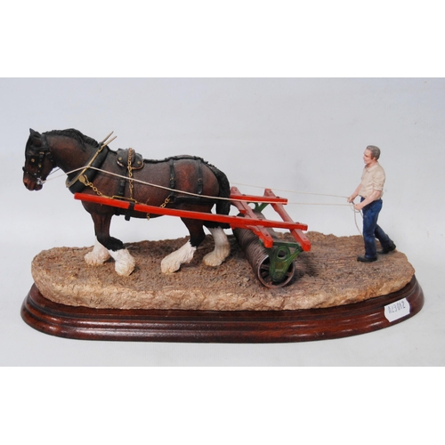 268 - Border Fine Arts group modelled as a farmer with a horse and Cambridge roller, on a fixed stand, 29c... 