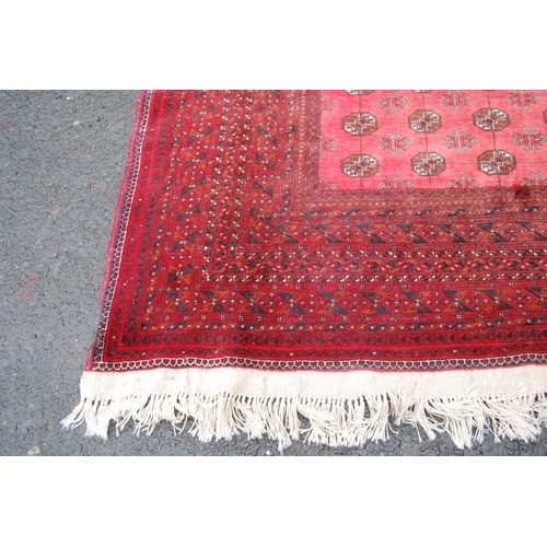 363 - Afghan Bokhara carpet with eighteen rows of seven geometric medallions, further geometric lozenge to... 