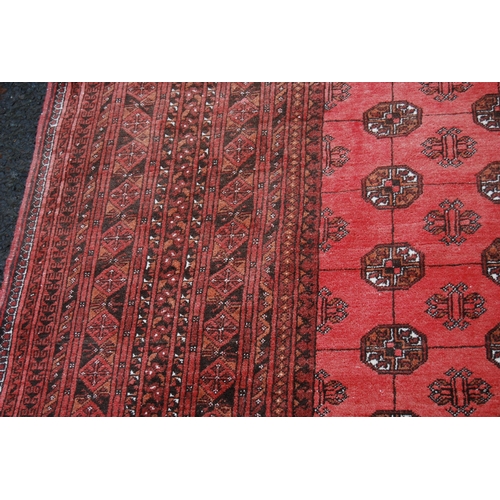 363 - Afghan Bokhara carpet with eighteen rows of seven geometric medallions, further geometric lozenge to... 