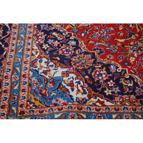 364 - Persian Tabriz carpet with a large medallion to the centre, all over foliate swags to the border, on... 