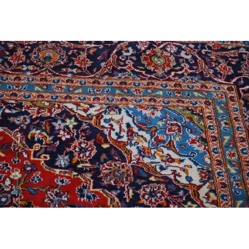 364 - Persian Tabriz carpet with a large medallion to the centre, all over foliate swags to the border, on... 