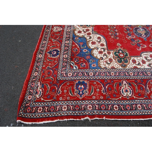 365 - Large Persian Keshan carpet with a large medallion to the centre within all over floral medallions a... 