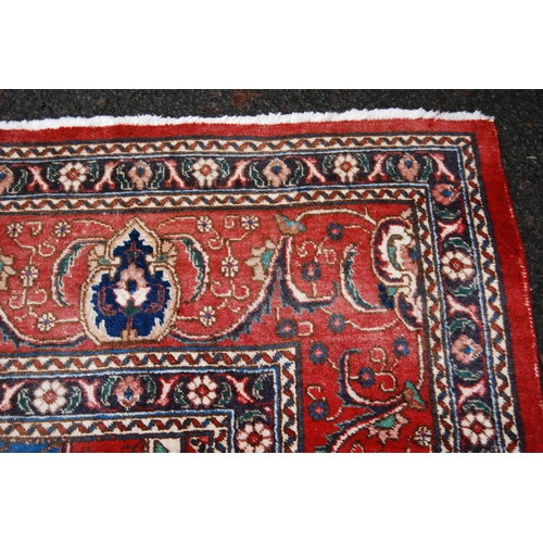 365 - Large Persian Keshan carpet with a large medallion to the centre within all over floral medallions a... 