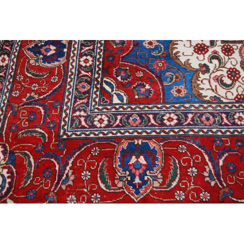 365 - Large Persian Keshan carpet with a large medallion to the centre within all over floral medallions a... 