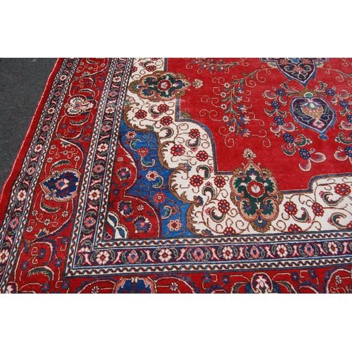 365 - Large Persian Keshan carpet with a large medallion to the centre within all over floral medallions a... 