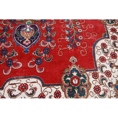 365 - Large Persian Keshan carpet with a large medallion to the centre within all over floral medallions a... 