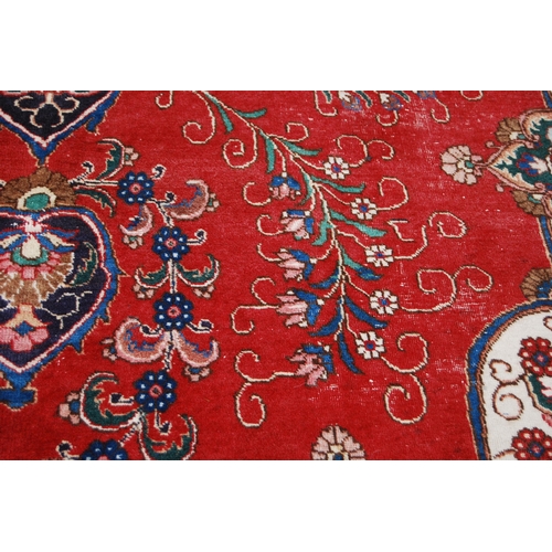 365 - Large Persian Keshan carpet with a large medallion to the centre within all over floral medallions a... 