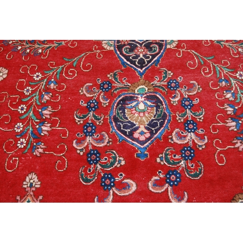 365 - Large Persian Keshan carpet with a large medallion to the centre within all over floral medallions a... 