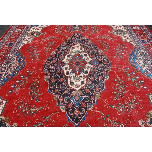 365 - Large Persian Keshan carpet with a large medallion to the centre within all over floral medallions a... 