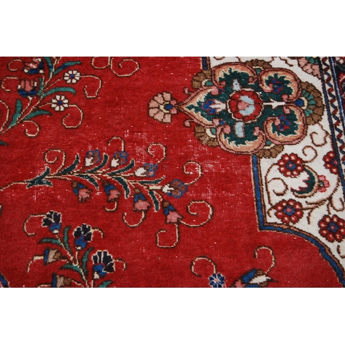 365 - Large Persian Keshan carpet with a large medallion to the centre within all over floral medallions a... 