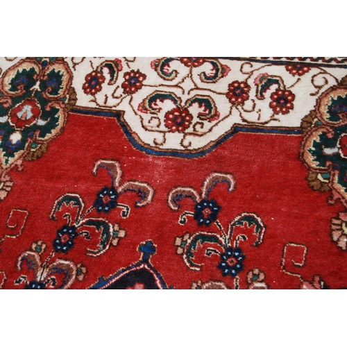 365 - Large Persian Keshan carpet with a large medallion to the centre within all over floral medallions a... 