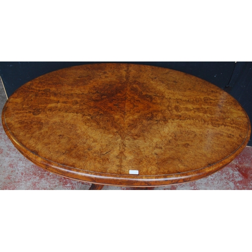 416 - Victorian burr walnut loo-type table, the oval top with snap action mechanism, on turned column and ... 