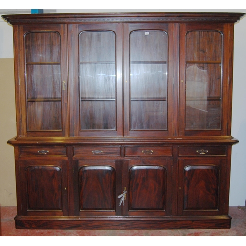 419 - Victorian-style mahogany four-door library bookcase, the dentil decorated cornice above four glazed ... 