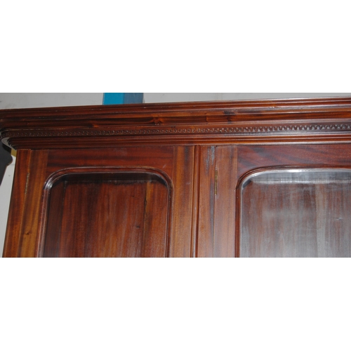 419 - Victorian-style mahogany four-door library bookcase, the dentil decorated cornice above four glazed ... 