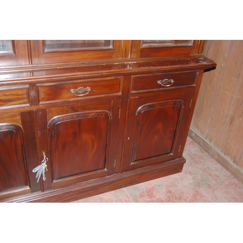 419 - Victorian-style mahogany four-door library bookcase, the dentil decorated cornice above four glazed ... 