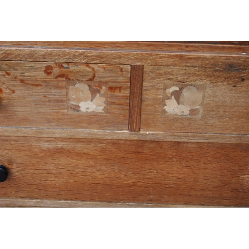 421 - 1920s oak chest of drawers in the manner of Heal's of London, with two short drawers, each with a ma... 