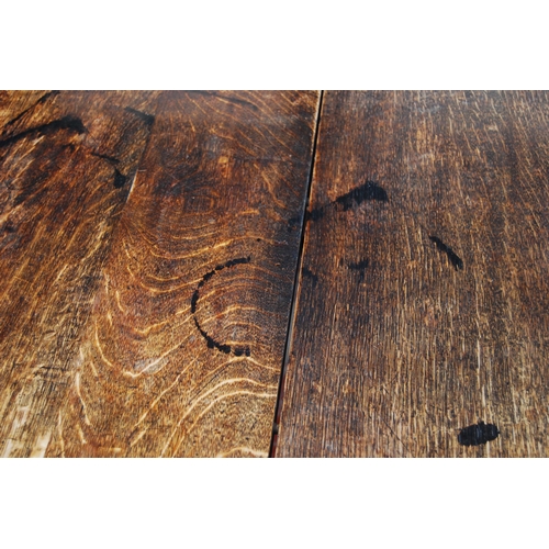 422 - Oak extending dining table, c. early 20th century, with two additional leaves, with incised decorati... 