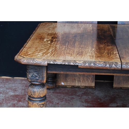 422 - Oak extending dining table, c. early 20th century, with two additional leaves, with incised decorati... 