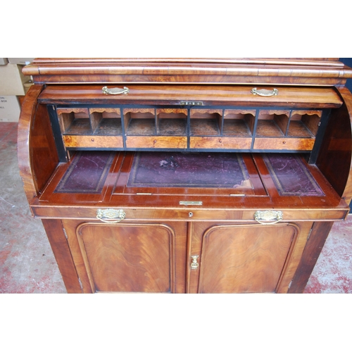 424 - Victorian mahogany library bookcase on cylinder bureau base, the bookcase section with two glazed do... 