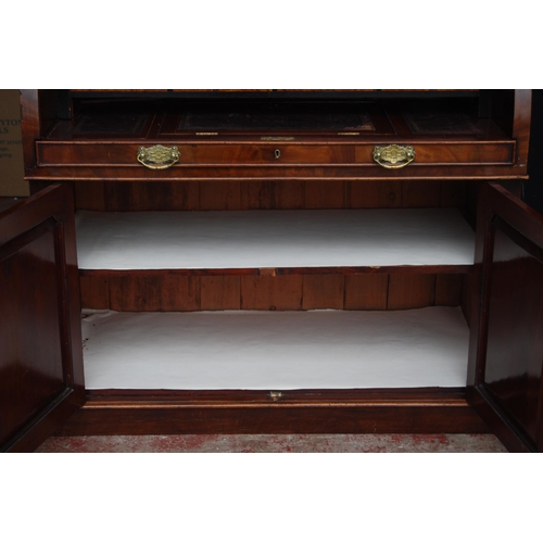 424 - Victorian mahogany library bookcase on cylinder bureau base, the bookcase section with two glazed do... 