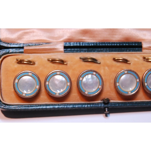 127 - Set of six blue enamel and mother of pearl dress studs, 1cm diameter, in fitted case.